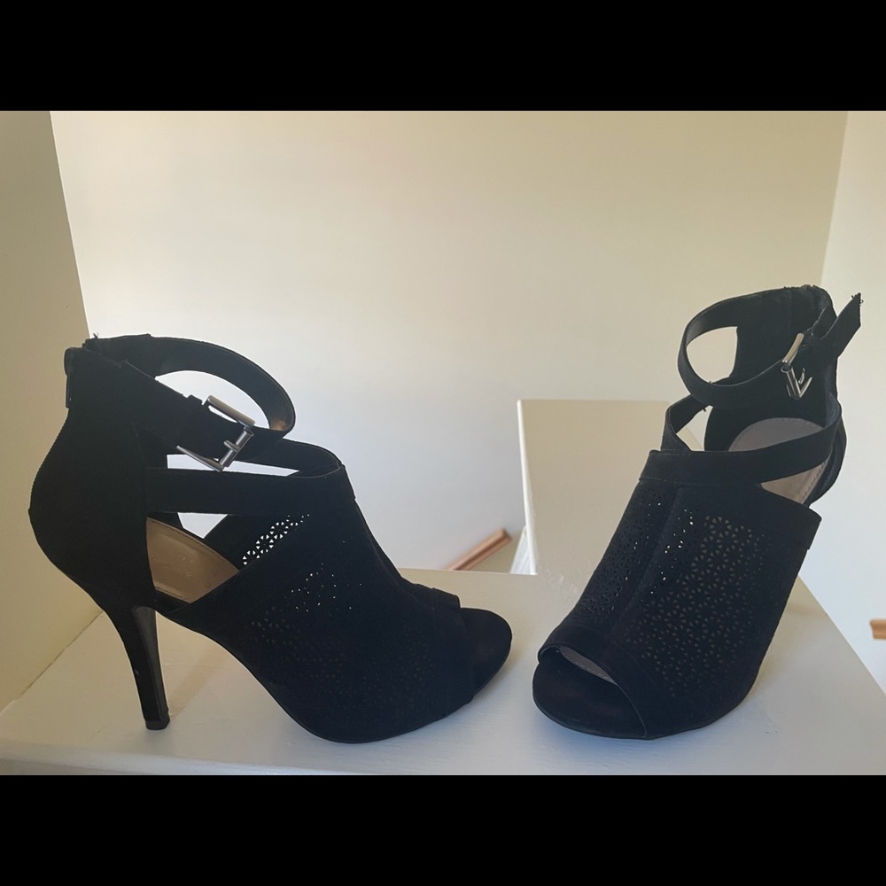 Black opened toe ankle heels.